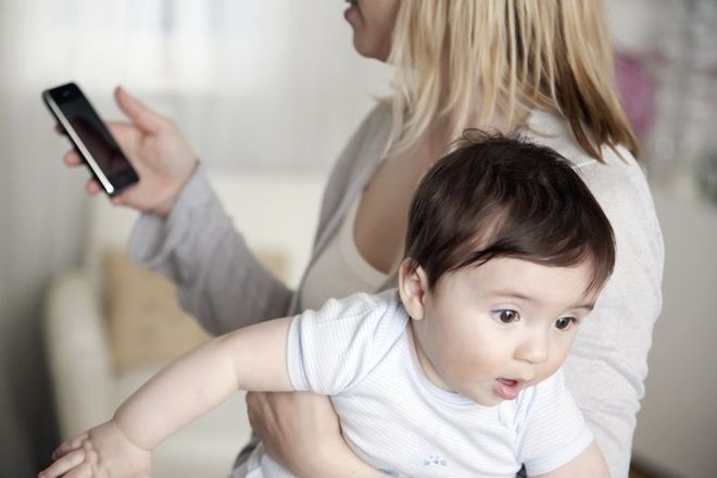 mom smartphone and baby