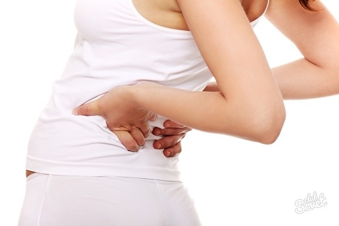 một số chị em bị đau lưng sau khi đặt vòng tránh thai