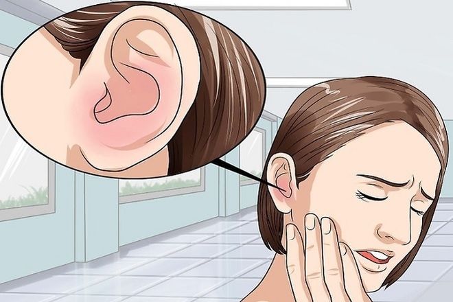 người phụ nữ bị đau tai