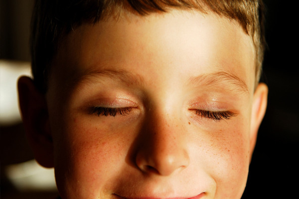 boy closing eyes